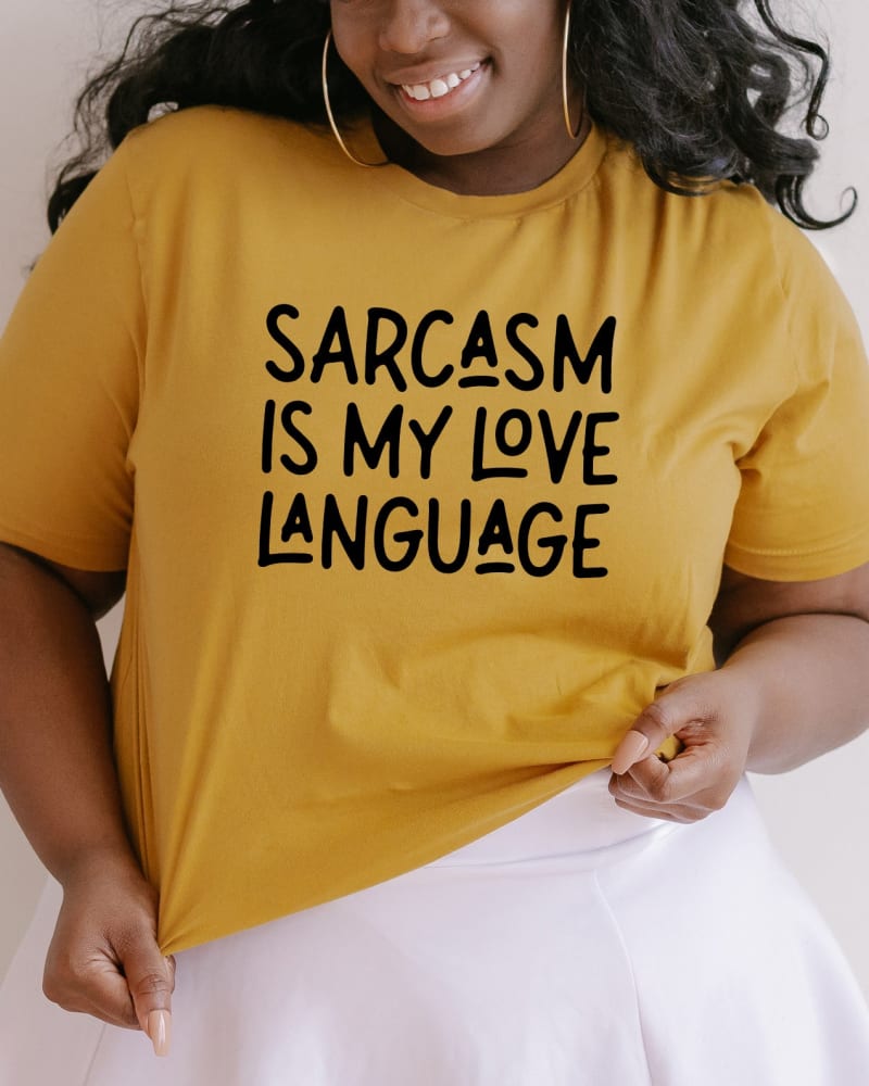 Front of a model wearing a size Large Sarcasm Is My Love Language in Mustard by Simply Sage Market. | dia_product_style_image_id:281436
